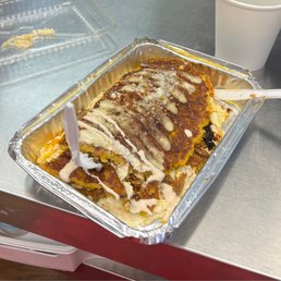 a pan of food with a knife in it a pan of food with a knife in it