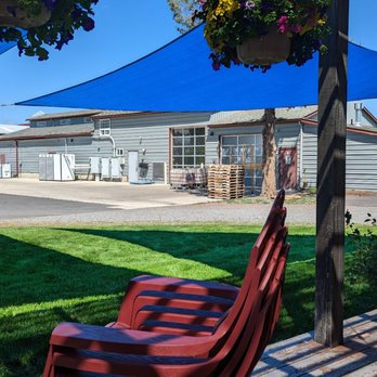 Crater Lake Spirits - a patio area with a hammock and chairs - Beer, Wine & Spirits Near Me - Bend, Oregon Crater Lake Spirits - a patio area with a hammock and chairs - Beer, Wine & Spirits Near Me - Bend, Oregon