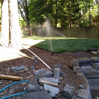 M & J Landscaping - a sprinkler spraying water on a lawn - Landscaping Near Me - Kent, Washington M & J Landscaping - a sprinkler spraying water on a lawn - Landscaping Near Me - Kent, Washington
