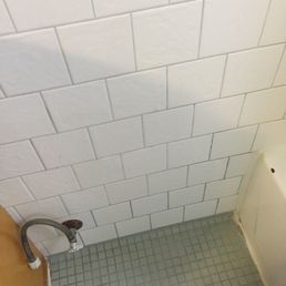 Patched hole in wall tile