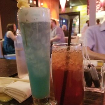 Sushi Pop - The blue looking Nalibu cocktail made my wife happy while my brother and I sipped warm sake - Sushi Bars Near Me - Oviedo, Florida