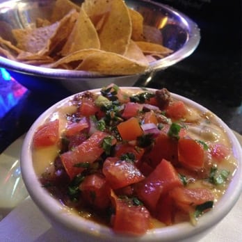 Lupe's Comida con Sabor - Lupita's dip with queso, beef, and pico de gallo. Get some! - Tex-Mex Near Me - Arlington, Texas