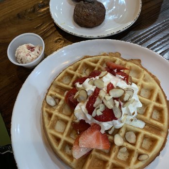 Red Oak Cafe - Belgian waffle topped with whipped strawberry butter, sliced strawberries, whipped cream and sliced almonds. - Breakfast & Brunch Near Me - Alvin, Texas Red Oak Cafe - Belgian waffle topped with whipped strawberry butter, sliced strawberries, whipped cream and sliced almonds. - Breakfast & Brunch Near Me - Alvin, Texas