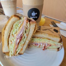 Korean breakfast sandwich and a hot americano. butter latte in background