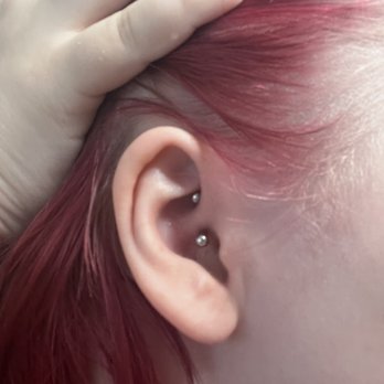 Black List Tattoo & Piercing - Picture from the morning before removal. Notice the different angle and even less bar visible. - Tattoo Near Me - Pearland, Texas