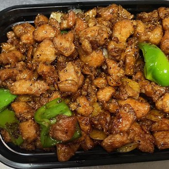 Top China - a black plastic container filled with chicken and peppers - Chinese Near Me - Martinez, Georgia Top China - a black plastic container filled with chicken and peppers - Chinese Near Me - Martinez, Georgia