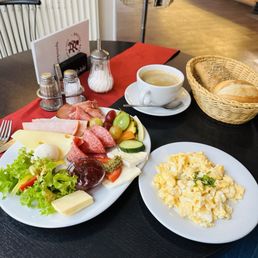Breakfast plate. Surprised me how tasty it was with an assortment of meats cheeses breads  Highly recommend the cafe cream large