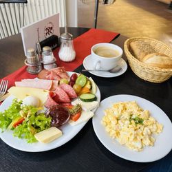 Brezel Berlin - Breakfast plate. Surprised me how tasty it was with an assortment of meats cheeses breads Highly recommend the cafe cream large