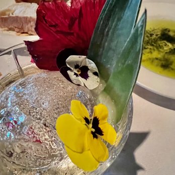 Tarbell's - close up of flowers on Elixir 6 cocktail - New American Near Me - Phoenix, Arizona