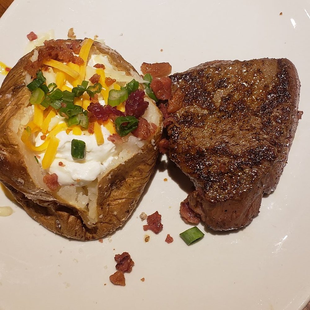 Outback Steakhouse - Loaded baked potato and my 6 oz steak served rare - Steakhouses Near Me - Schaumburg, Illinois Outback Steakhouse - Loaded baked potato and my 6 oz steak served rare - Steakhouses Near Me - Schaumburg, Illinois