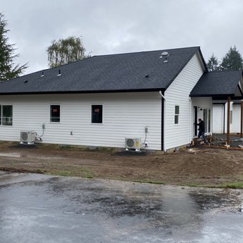 PHD Construction - Addition, nearly finished. Concrete crew setting up to pour patios and walkways. - General Contractors Near Me