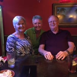 three people sitting at a table