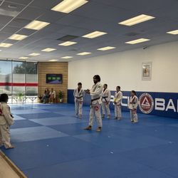 Jiu jitsu class. Small with lots of coaches to support the kids.