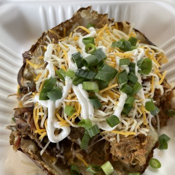 Smokey Bonez BBQ - Loaded baked potato. We call this one the " Double Wide" with everything on it! - Food Trucks Near Me Smokey Bonez BBQ - Loaded baked potato. We call this one the " Double Wide" with everything on it! - Food Trucks Near Me