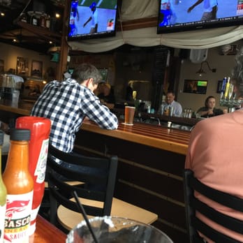 Fini's Landing - bar area - drinks are flowing and plenty of TVs - New American Near Me - Tucson, Arizona