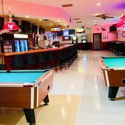 9 TVs to catch your favorite sporting event, two pool tables, two dart boards, and a jukebox.
