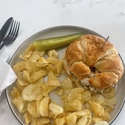 The Bean - Chicken salad croissant sandwich. Served with pickle spear and chips. $9.50.