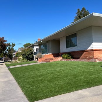 MVP General Contractor - Front yard with new synthetic turf and pavers - Masonry/Concrete Near Me