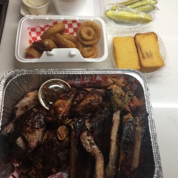 Pig Out BBQ - Pig out platter delivered by Just Eat side corn bread, coleslaw, onion rings - Barbeque Near Me - Toronto, Ontario