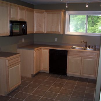 ShreveCo Building & Remodeling - a kitchen with light wood cabinets and black appliances - General Contractors Near Me - Harrisburg, Pennsylvania ShreveCo Building & Remodeling - a kitchen with light wood cabinets and black appliances - General Contractors Near Me - Harrisburg, Pennsylvania