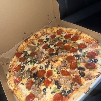 Manninos Pizzeria - Special full of toppings only $22 - Pizza Near Me - Davenport, Florida