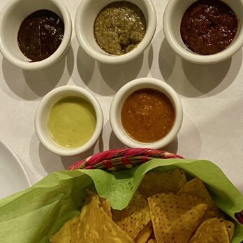 Mis Moles Restaurant - Chips and dipping sauces including green sauce and different types of Moles. All delicious - Mexican Near Me - Chicago, Illinois Mis Moles Restaurant - Chips and dipping sauces including green sauce and different types of Moles. All delicious - Mexican Near Me - Chicago, Illinois
