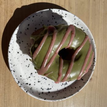 Fox & Oak - Up close on my vegan strawberry matcha donut. Loved the donut and the cute plate it came on. - Donuts Near Me - Squamish, British Columbia