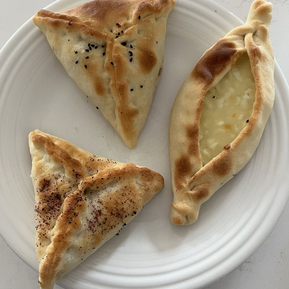 Bakery savory pastries. One with cheese. One with spinach. One with meat. All delicious. Bakery savory pastries. One with cheese. One with spinach. One with meat. All delicious.