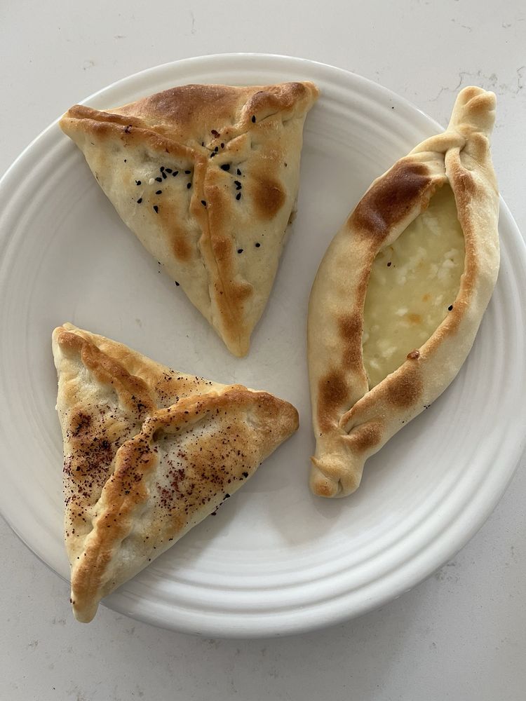 StopBy Bakery & Deli Logo