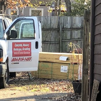 Adiches Concrete & Construction - a white truck parked in front of a house - General Contractors Near Me