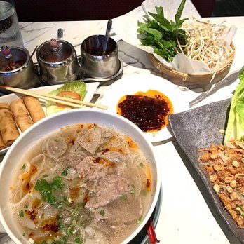 Pho Vanhly Asian Bistro - Combo pho, spring rolls, crispy rice & pork salad. A must have. I love the LEMONGRASS CHILI OIL - Noodles Near Me - Wilmington, North Carolina Pho Vanhly Asian Bistro - Combo pho, spring rolls, crispy rice & pork salad. A must have. I love the LEMONGRASS CHILI OIL - Noodles Near Me - Wilmington, North Carolina