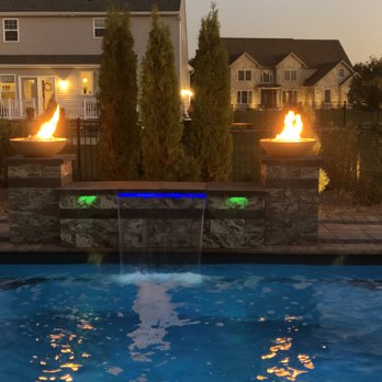 Stanford Scapes - a pool with a fire feature - Landscaping Near Me - Mechanicsburg, Pennsylvania Stanford Scapes - a pool with a fire feature - Landscaping Near Me - Mechanicsburg, Pennsylvania