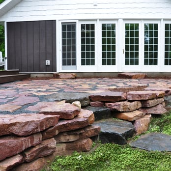 Eco Harmony Landscape & Design - Natural courtyard Patio and Retaining Wall located in Holcombe, WI - Landscaping Near Me - Brookfield, Wisconsin Eco Harmony Landscape & Design - Natural courtyard Patio and Retaining Wall located in Holcombe, WI - Landscaping Near Me - Brookfield, Wisconsin