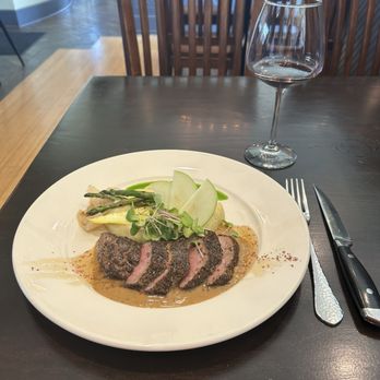 Wild Sage Bistro - Pork Tenderloin smothered in a cream jus with seasonal vegetables. - New American Near Me - Spokane, Washington Wild Sage Bistro - Pork Tenderloin smothered in a cream jus with seasonal vegetables. - New American Near Me - Spokane, Washington