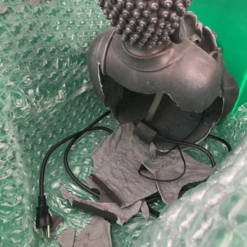 MakeSpace - Los Angeles - Broken black resin Buddha water fountain - Self Storage Near Me MakeSpace - Los Angeles - Broken black resin Buddha water fountain - Self Storage Near Me