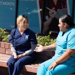 UEI College - Oceanside - Students chatting outside UEI College Oceanside.