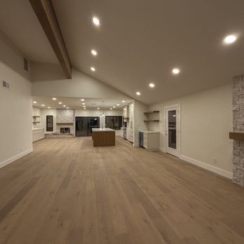 KHB Construction - Main Living Room, looking into kitchen with elevated 9' kitchen ceilings, load bearing wall removed for an open concept feel. New island. - General Contractors Near Me - Turlock, California