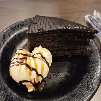 Buffalo Wild Wings - Birthday chocolate cake and ice cream topped with chocolate and caramel drizzle - Chicken Wings Near Me - Montclair, California