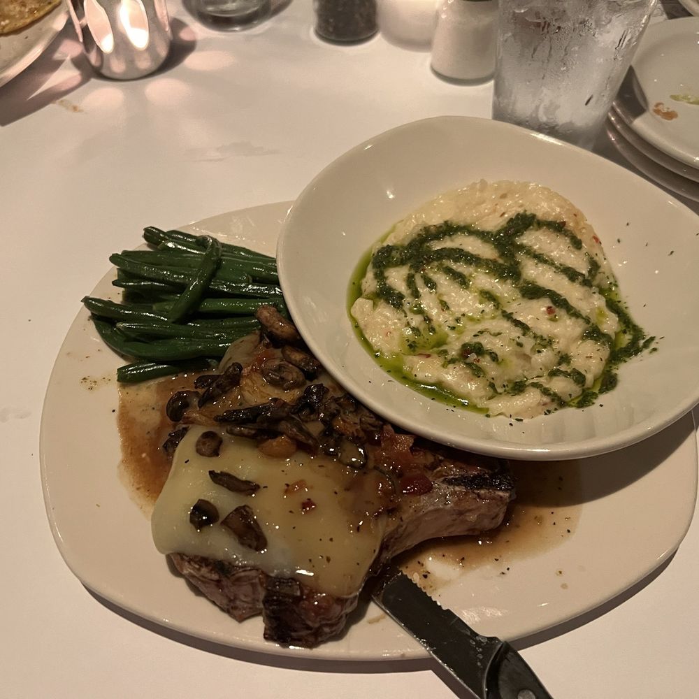 Fontina Pork Chop with risotto and green beans