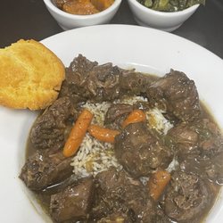 Darrell Kelley's Soul Delicious - Turkey necks over rice with candied yams and greens for the side with a corn bread muffin.