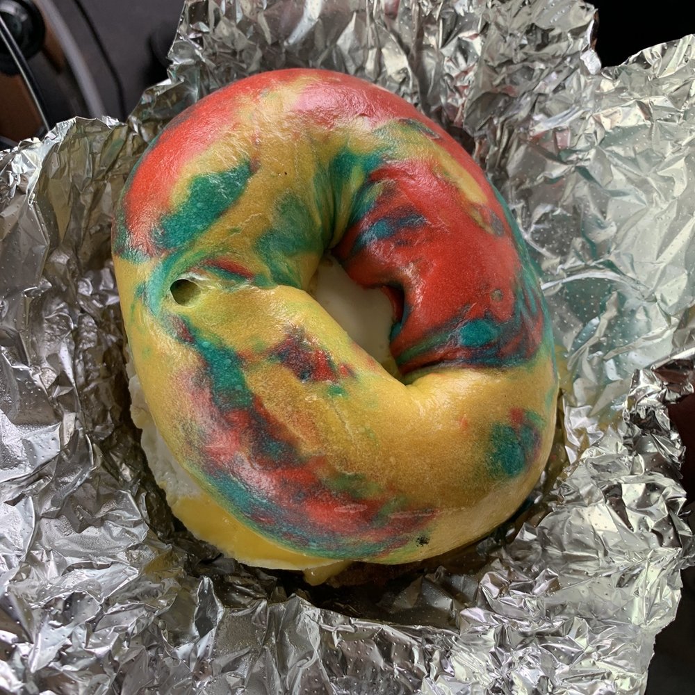 Sausage egg and cheese on a rainbow bagel