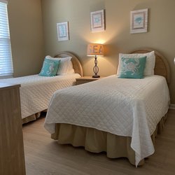Sandy Beach Vacation Rentals - Guest bedroom with twin beds and new floors.