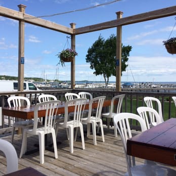 Mackinac Grille - The back patio view of the harbor. - Seafood Near Me - Saint Ignace, Michigan