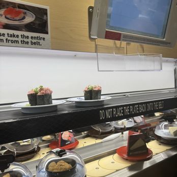 Kura Revolving Sushi Bar - Your order through the pad comes in a belt above the grab-&-go belt - Conveyor Belt Sushi Near Me - Boulder, Colorado Kura Revolving Sushi Bar - Your order through the pad comes in a belt above the grab-&-go belt - Conveyor Belt Sushi Near Me - Boulder, Colorado
