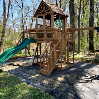Willard Services - a wooden swing set with a green slide - Furniture Assembly Near Me Willard Services - a wooden swing set with a green slide - Furniture Assembly Near Me