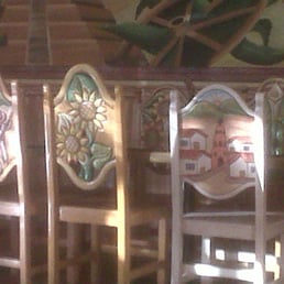 Carved and painted chairs and tables