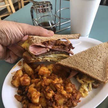 Kevin's Coffee Shop - King Kong breakfast sandwich on whole wheat (rolls are available) with home fries - Coffee & Tea Near Me - Oceanside, New York Kevin's Coffee Shop - King Kong breakfast sandwich on whole wheat (rolls are available) with home fries - Coffee & Tea Near Me - Oceanside, New York