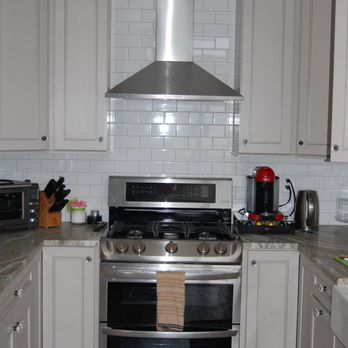 STC Renovations - a kitchen with stainless steel appliances - Siding Near Me STC Renovations - a kitchen with stainless steel appliances - Siding Near Me