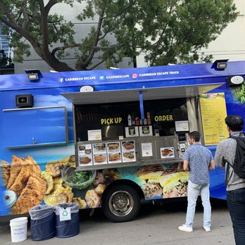 Caribbean Escape - a blue food truck parked in a parking lot - Caribbean Near Me Caribbean Escape - a blue food truck parked in a parking lot - Caribbean Near Me