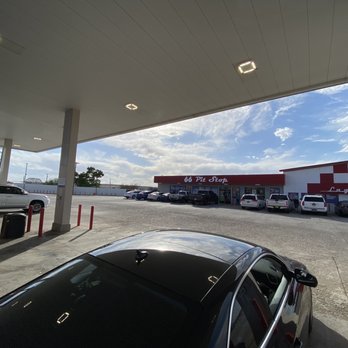 66 Pit Stop - a gas station with cars parked in the lot - Gas Stations Near Me - Laguna, New Mexico